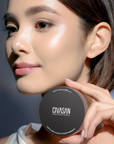 Model holding CIVASAN Cushion Compact for natural radiant makeup