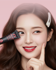 A female model holding the Morichae Lip Tattoo Tint Pack near her face, showcasing naturally vibrant, tinted lips with a glossy and healthy finish.